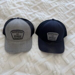 Travis Mathew Bushwood CC Champion Trucker Hats